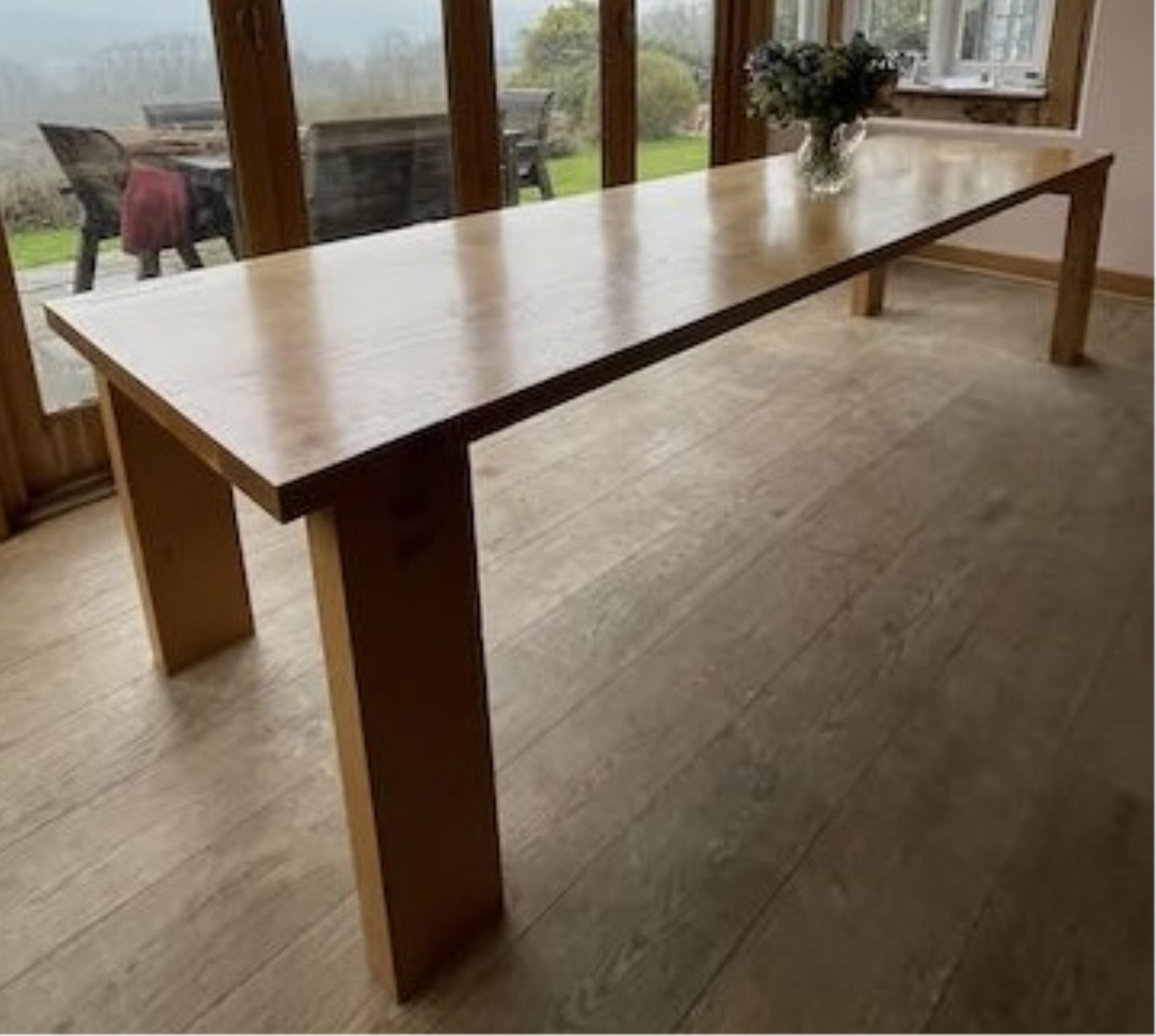 A Contemporary oak rectangular dining table, width 300cm, depth 84cm, height 74cm. Condition - fair